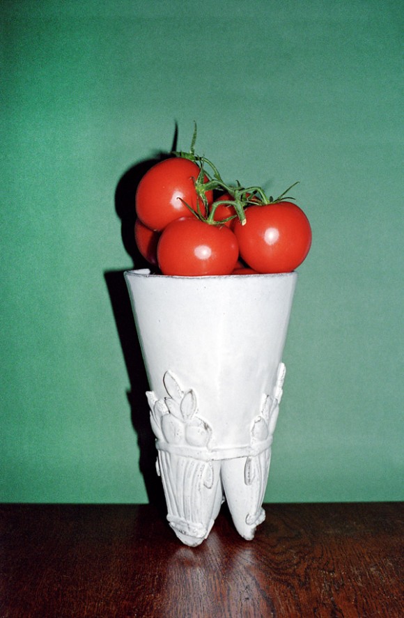 Vase with tomatoes